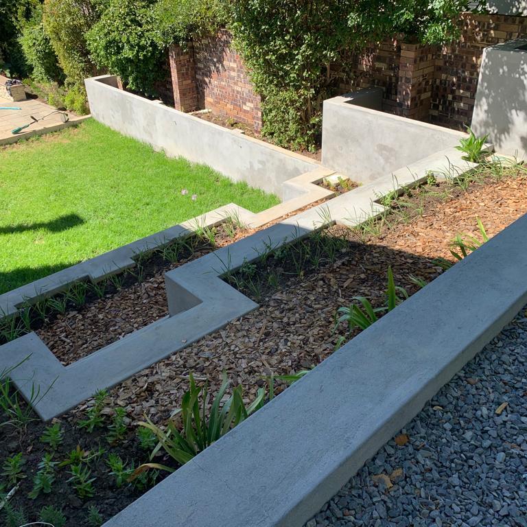 Terraced concrete retaining walls